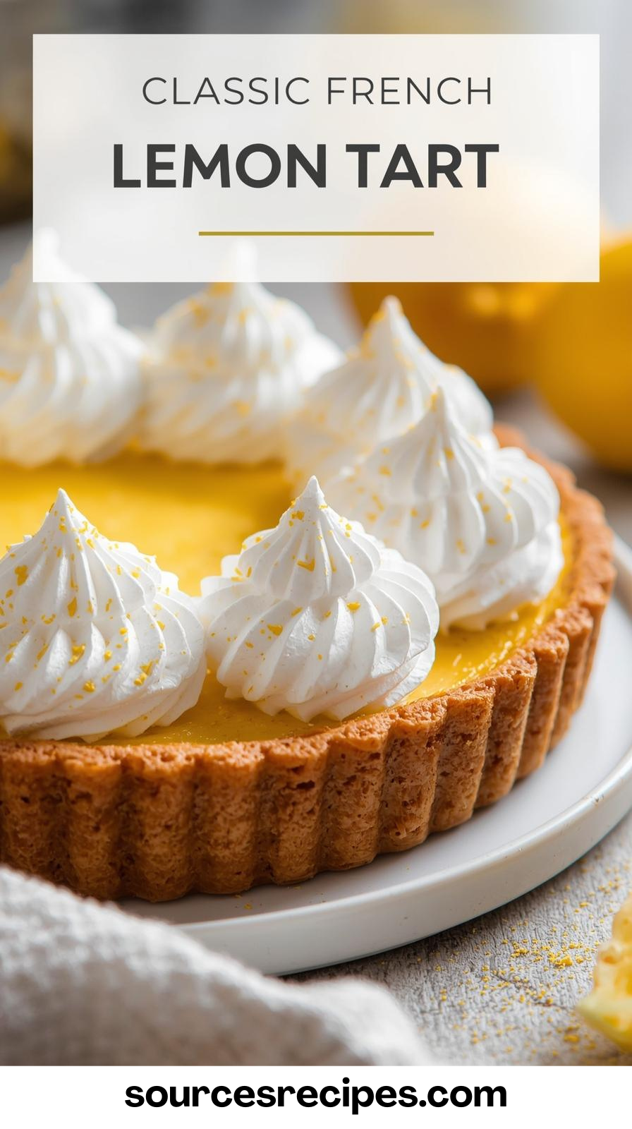 A beautiful French Lemon Tart with a golden crust and topped with toasted meringue kisses